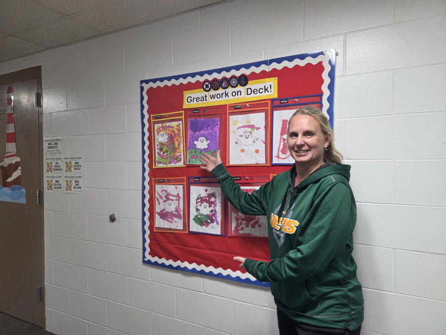 Nevis Superintendent Ranae Seykora poses near a bulletin board during a tour of the school on Oct. 27, 2026.