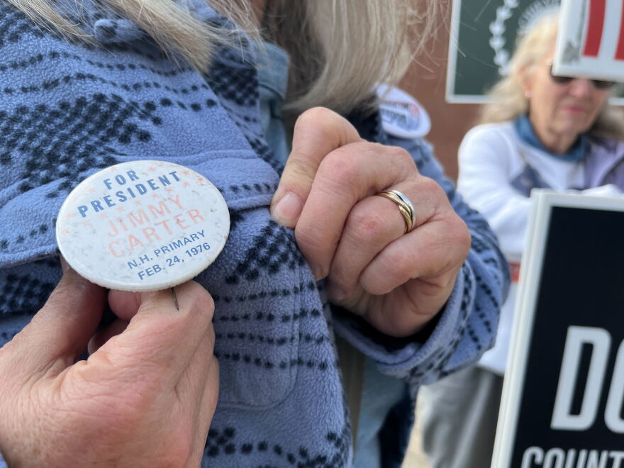 Sara Smith of Pembroke was outside the polls at Pembroke Academy stumping for this year's crop of Democratic candidates -- but sported a vintage Jimmy Carter campaign button from 1976