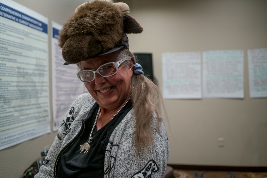 Susan Reneau, hunting book author and plaintiff in a 2016 lawsuit over the National Bison Range, sporting a bison hat at the at a public meeting in Polson, May 1, 2019.