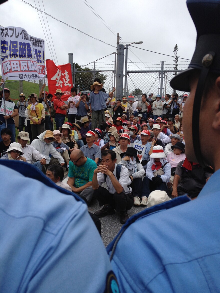 Protesters block an entrance to U.S. Marine Corps Air Station Futenma in Ginowan, Japan.