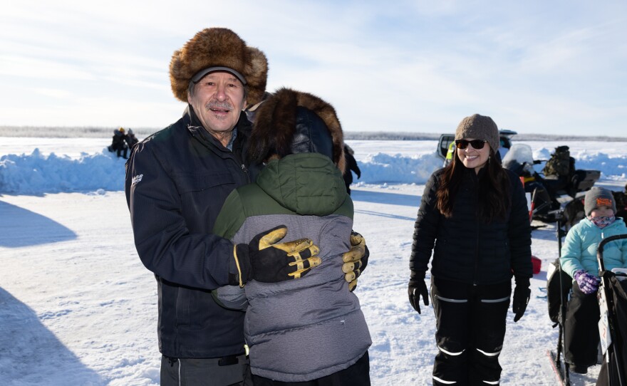 Gonders Hoffman hugs his grandson Ari Kaiser at the start of the 2025 Kuskokwim 300 Sled Dog Race on Feb. 7, 2025.