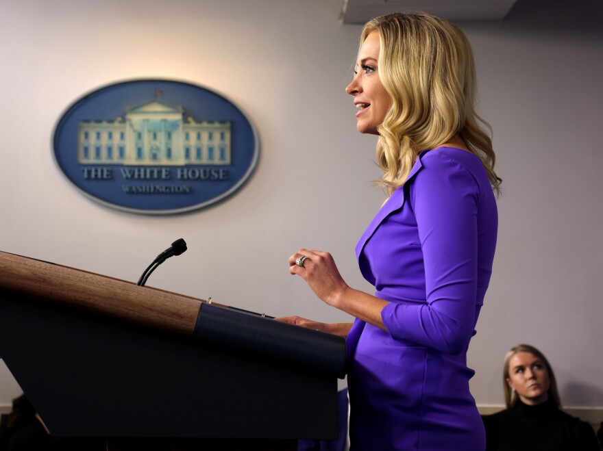 Leavitt sits to the right side of then White House Press Secretary Kayleigh McEnany as she holds a briefing at the James Brady Press Briefing Room of the White House.