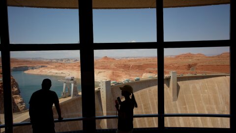 People look at the Glen Canyon Dam, July 14, 2026, near Page, Arizona.