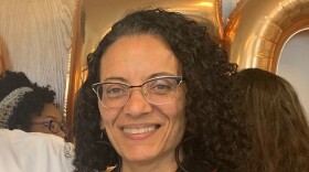 A black woman with hoop earrings