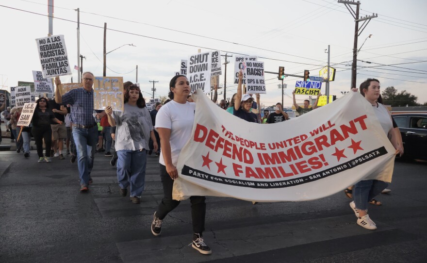 Protesters speak out against a raid that occurred in the early morning hours of November 16, 2025