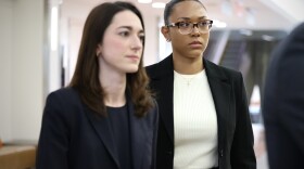 Surrogate McKenna West walks into a courtroom for a hearing regarding a temporary restraining order Tuesday, Aug. 25, 2026, in Dallas.
