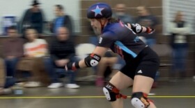 A member of the Des Moines Roller Derby serves as the team's "jammer," a player who serves as the team's primary scorer, marked by a star on their helmet. To score, the jammer must race through a pack of "blockers" and lap players on the opposing team.