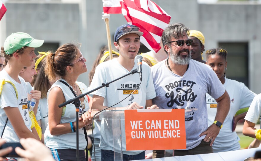 David Hogg, Parkland shooting victim and survior (center), joins Manuel Oliver and his wife, Patricia Oliver, parents of Parkland shooting victim Joaquin Oliver.