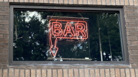 A neon sign over a bar in Columbus.