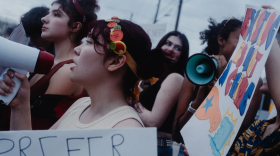 Protesters, many of them high school students, show up in front of a site believed to be an ICE detention facility on Algreg Street in Pflugerville on Feb. 13, 2026.