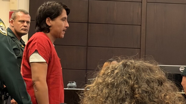 Anghelo Ita Durand walking into the courtroom getting ready to speak with the judge.
