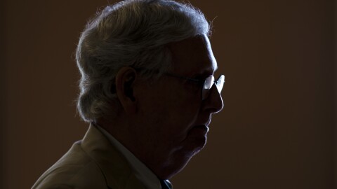 FILE - Senate Minority Leader Mitch McConnell, R-Ky., is silhouetted by window light as he heads to the chamber to begin the week, on Capitol Hill in Washington, June 21, 2021. (AP Photo/J. Scott Applewhite, File)