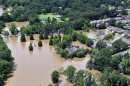 An aerial view taken from an MH-65 Dolphin helicopter shows severe flooding in a residential area of Baton Rouge, LA on Aug. 15, 2016. Coast Guard photo by Petty Officer 1st Class Melissa Leake.
