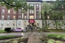Patients and staff exit the Portland neighborhood location of Family Health Centers on a rainy day in Louisville.