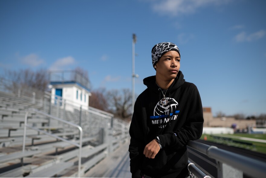 Jalen Beard, 18, a friend and teammate of Deshaun Hill Jr., stands by the football field at school. Beard plans to attend St. Olaf College.