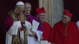 Newly elected Pope Leo XIV, left, formerly Cardinal Robert Francis Prevost, appears (left) at the Vatican shortly after his election as the 267th pontiff of the Roman Catholic Church, Thursday, May 8, 2025.