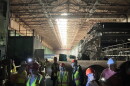 Participants in one of the first public tours of the former Pactiv Evergreen paper mill walk through the facility Thursday, Aug. 13, 2026.