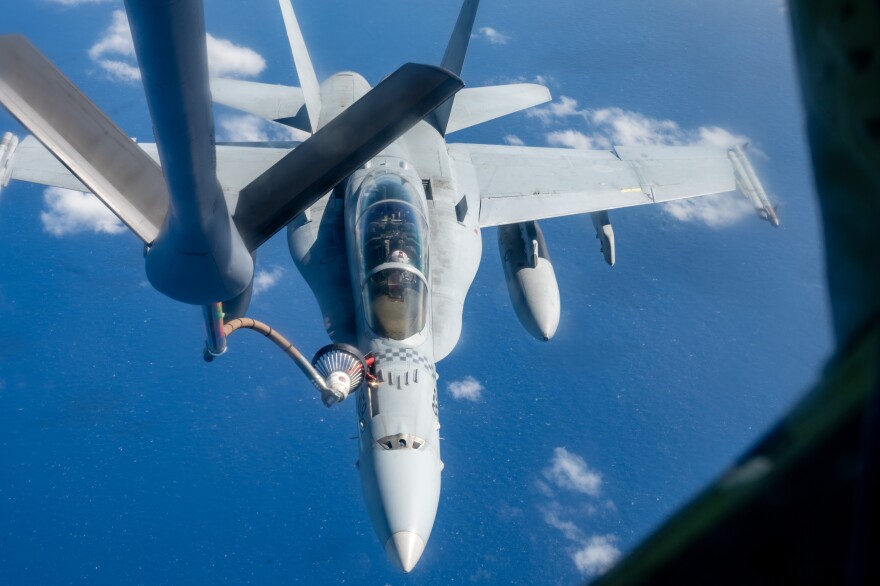 A U.S. Air Force KC-135 Stratotanker from the 72nd Air Refueling Squadron, Grissom Joint Air Reserve Base, Indiana refuels a U.S. Marine Corps F/A-18D Hornet assigned to the Marine Fighter Attack Squadron (VMFA) 312, Marine Corps Air Station Beaufort, South Carolina, Feb. 11, 2025, over the U.S. Indo-Pacific Command area of responsibility during exercise Cope North 2025. CN25 Participants exercise interoperability during CN25 through agile, integrated generation of airpower, demonstrating resilience and survivability in a contested environment. (U.S. Air Force photo by Staff Sgt. Caleb Roland)