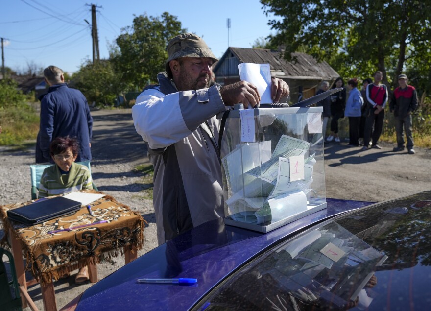 People cast their votes in controversial referendums in Donetsk, Ukraine on Sunday.