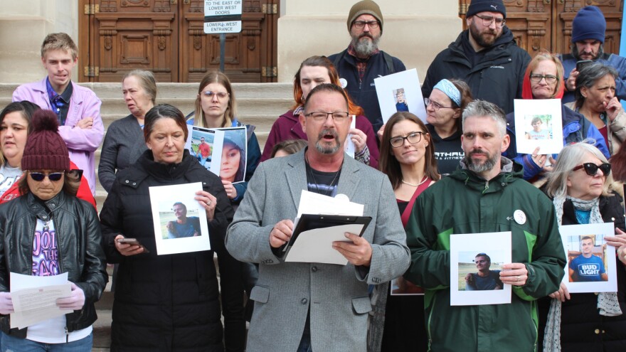 Advocates with Care, Not Cuffs gathered at the statehouse to voice opposition to bills penalizing sleeping outside and putting restrictions on needle exchange programs. Tony Hostetler (center) led members in a chant, ‘nothing about us without us.’