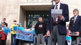 Andy Harris with the group Physicians for Social Responsibility speaks at a rally against coal export terminals outside a meeting of the Oregon State Land Board in Salem