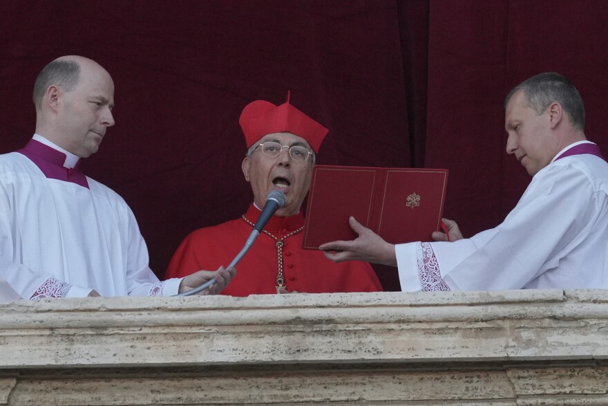 Cardinal Dominique Mamberti announces the election of the new pope, at the Vatican, Thursday, May 8, 2025. (AP Photo/Andrew Medichini)