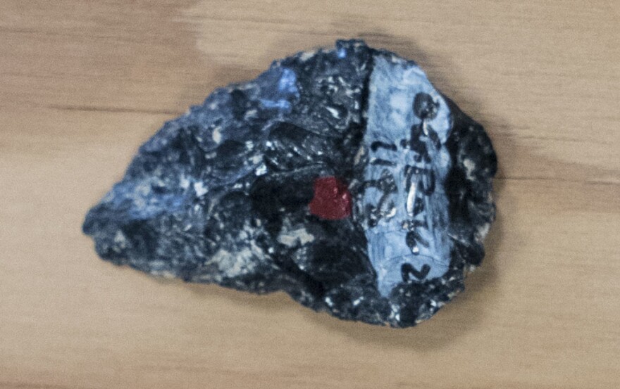 A small stone point made of non-local obsidian. The chemical composition of the artifact matches obsidian sources as far as 55 miles away.