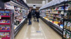 Customers shop at a grocery store in Mount Prospect, Ill., Friday, April 1, 2022. A USF survey found that 77 percent percent of respondents said inflation has affected their grocery spending.  (Nam Y. Huh/AP/WUSF)