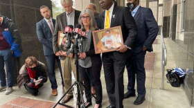 Attorney Ben Crump (Front-R), mother Sara Walker (Front-C), and Thomas Walker (Front-R) annouce a lawsuit alleging the wrongful death of Caleb Walker. Photo: Nicole Darden-Creston, WMFE
