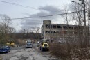 Crews have staged construction equipment at 5 Flint St., where they are getting ready to demolish a crumbling former warehouse.