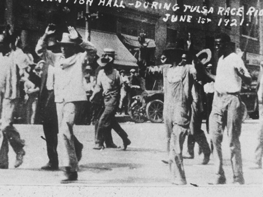 Black detainees are led to the Convention Hall following a race riot in Tulsa, Okla, June 1, 1921. The National Guard rounded up blacks by the thousands and took them to the fairgrounds, the Convention Hall and a baseball stadium where they were given food and water. By day's end, many thriving black businesses in a 35-block area had been torched.