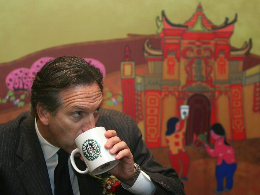 Howard Schultz sips coffee in Chongqing, China, in 2006. Schultz, who grew Starbucks into the global brand it is today, returns to the company as interim CEO after Kevin Johnson's departure.