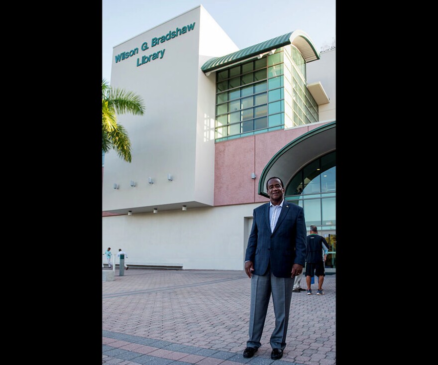 Florida Gulf Coast University president emeritus, Dr. Wilson Bradshaw in front of the Wilson G. Bradshaw Library