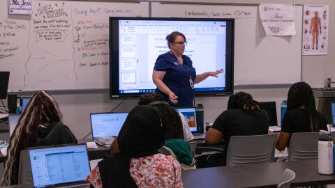 Nursing services instructor Jessica Cochran teaches a lesson on how to study for her class at John Marshall Enterprise High School's new college and career center.