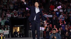 Democratic presidential candidate Andrew Yang waves to the crowd during the 100 Club Dinner at SNHIU in Manchester, New Hampshire.