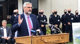 Indiana Gov. Eric Holcomb speaks during a bill signing ceremony at the Indiana Law Enforcement Academy in Plainfield, Ind., Monday, Aug. 16, 2021. Holcomb told reporters afterward that he supported the growing number of Indiana school districts issuing mask mandates for students and staff as they try to head off more COVID-19 outbreaks.