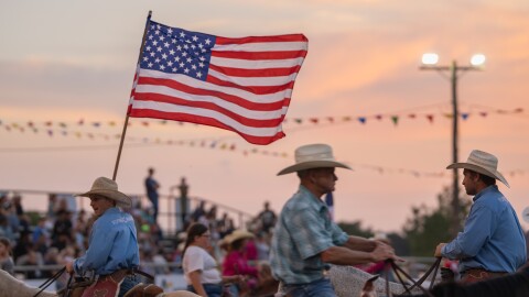 The American flag leads the Grand Entry to kick off the Wolfe City Rodeo on Friday, Aug. 7, 2026, in Wolfe City, Texas.