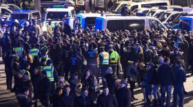 Police in Cologne, Germany hold a group of men in front of Hauptbahnhof main railway station. (Maja Hitij/Getty Images)