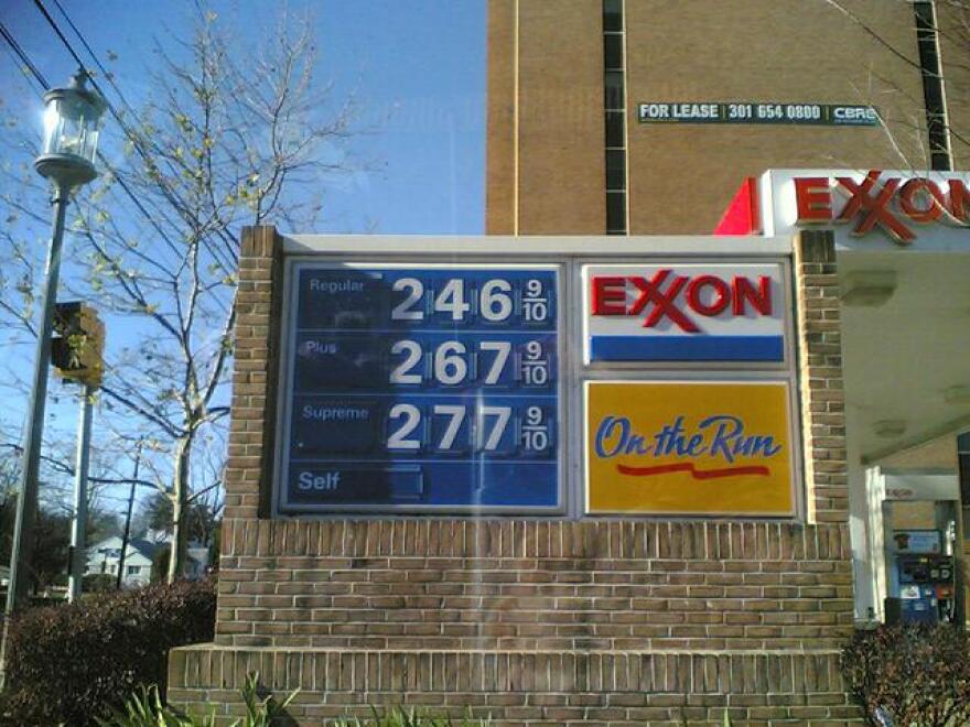 a sign showing gas prices