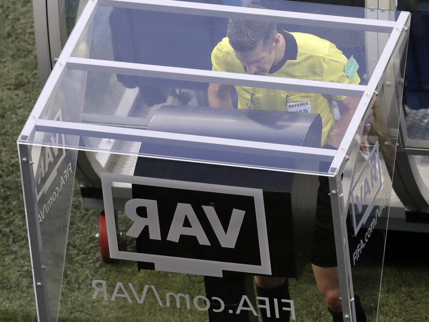 Referee Matt Conger watches the Video Assistant Referee system during the World Cup match between Nigeria and Iceland in Volgograd, Russia, on June 22.