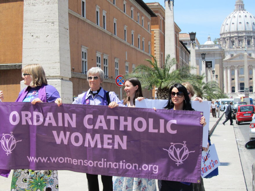 Representatives of the U.S.-based Women's Ordination Conference protest in front of St. Peter's Basilica at the Vatican. The group's executive director said the Vatican has turned a blind eye to male priests who "destroy the lives of children and families, but jumps at the chance to excommunicate women."