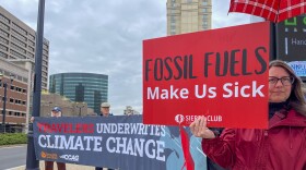 Climate change demonstrators gathered outside of Travelers' annual meeting in Hartford on May 15, 2024. The demonstrators want the insurance company to stop underwriting fossil fuel projects, and to sell its investments in fossil fuel companies. Several demonstrators also purchased stock in the company so they could ask questions during the annual meeting.