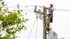 FILE - An FPL lineman works to repair power lines in Key Biscayne, Wednesday, Sept 28,2022. About 3,700 customers lost power, including government offices. Power was largely restored by mid-afternoon.