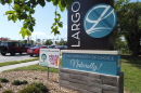 Largo sign with cars driving past it 