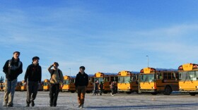 Students walk by school buses parked between Colony Middle and High Schools on Jan. 23, 2026.