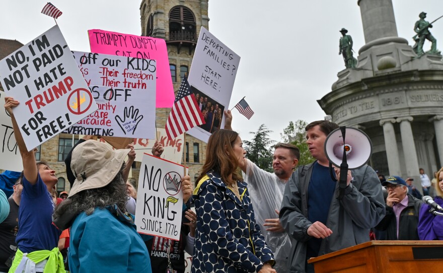 During Lackawanna County Commissioner Bill Gaughan's speech, protesters try to block a Trump supporter who held up a sign that read 'ZOO' during the 'No Kings Day' rally in Scranton.