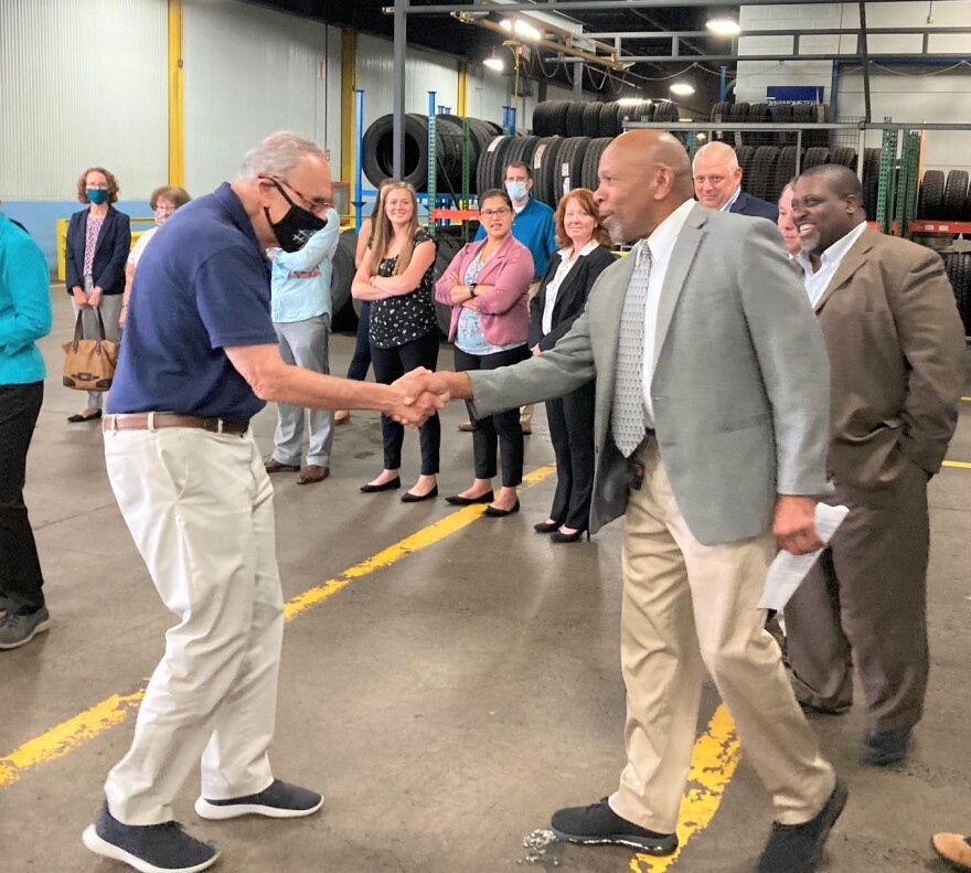 Sen. Schumer greets CENTRO board members upon his arrival at the bus garage in Syracuse.