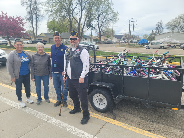 Left to Right, Elia Lopez, Snake River Elementary Family Services Coordinator, LaRita Schandorff, NBP director, Mark Person, Vice Commander of American Legion District 3, and Mark Marshall, American Legion Rider, Post 39.