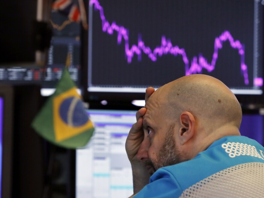 Specialist Meric Greenbaum works at his post on the floor of the New York Stock Exchange on Feb. 25, 2020.