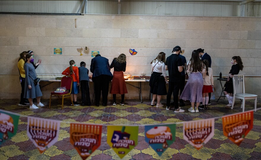 Jews light candles during Hanukkah at the Jewish Community Center in Dubai in December.